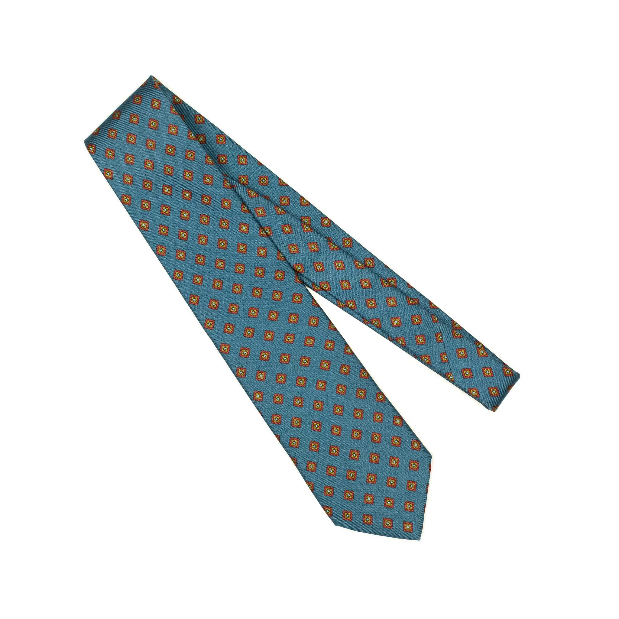 Hand-printed slate blue silk twill tie, rust and olive medallion print